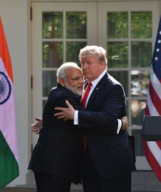 US President Donald Trump and Indian Prime Minister Narendra Modi embrace in the Rose Garden during a joint press conference at the White House in Washington, DC, June 26, 2017.