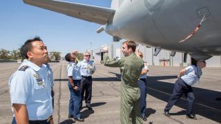 Flight Lieutenant Dylan Smith explains characteristics of the P-3C Orion with visiting Indonesian Air Force MARPAT representatives during the Exercise Albatross AUSINDO Initial Planning Conference
