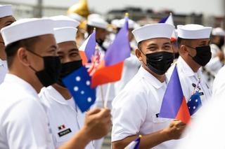 Sailors from the Philippine Navy await the arrival Royal Australian Navy ship HMAS Stalwart at the Port of Manila as part of Indo-Pacific Endeavour 2022
