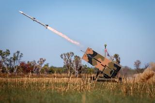 An Australian Army National Advanced Surface to Air Missile System (NASAMS) from the 16th Regiment, Royal Australian Artillery firing an AIM-120 missile during Exercise Talisman Sabre 2025 at Bradfield Training Area. Image has been digitally altered for security purposes.