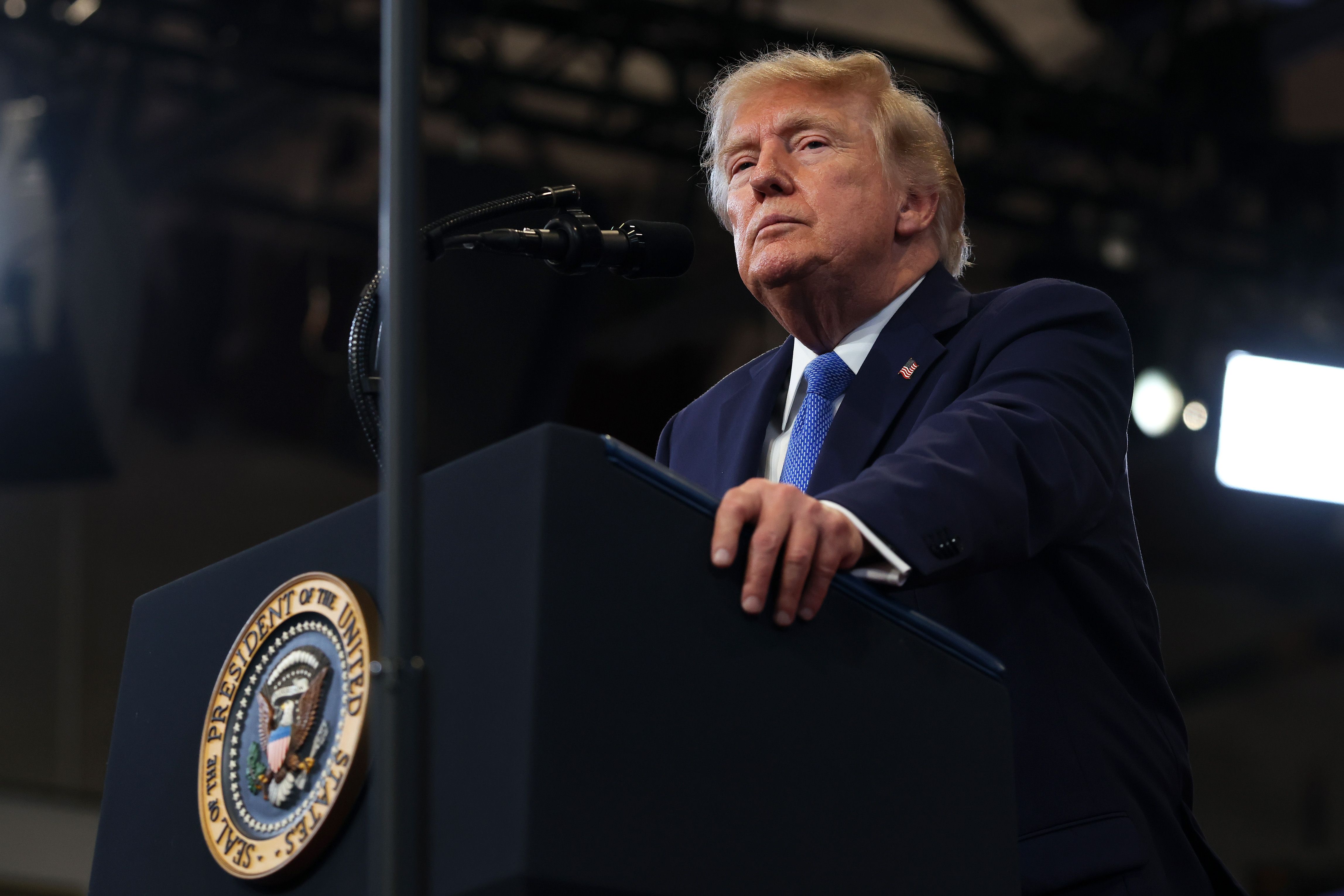 US President Donald Trump standing at a lectern.
