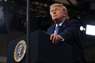 US President Donald Trump standing at a lectern.