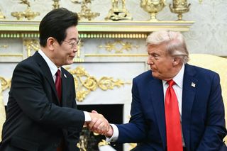 US President Donald Trump shakes hands with South Korean President Lee Jae Myung during a bilateral meeting in the Oval Office of the White House in Washington, DC, on August 25, 2025.