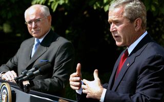 US President George W. Bush (R) and Australian Prime Minister John Howard speak in the Rose Garden at the White House June 3, 2004 in Washington, DC. The two leaders met in the Oval Office and discussed Australian and US relations as well as the war in Iraq.