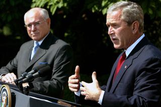 US President George W. Bush (R) and Australian Prime Minister John Howard speak in the Rose Garden at the White House June 3, 2004 in Washington, DC. The two leaders met in the Oval Office and discussed Australian and US relations as well as the war in Iraq.