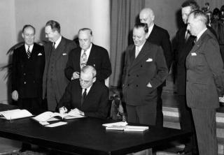 John Foster Dulles signs the Tripartite Security Treaty (ANZUS) with Secretary of State Dean Acheson (front right), San Francisco, September 1951