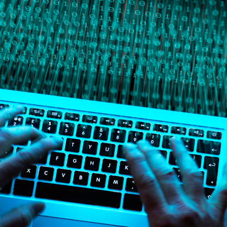 shady-computer-hacker-hands-header-GettyImages-1175889118.png