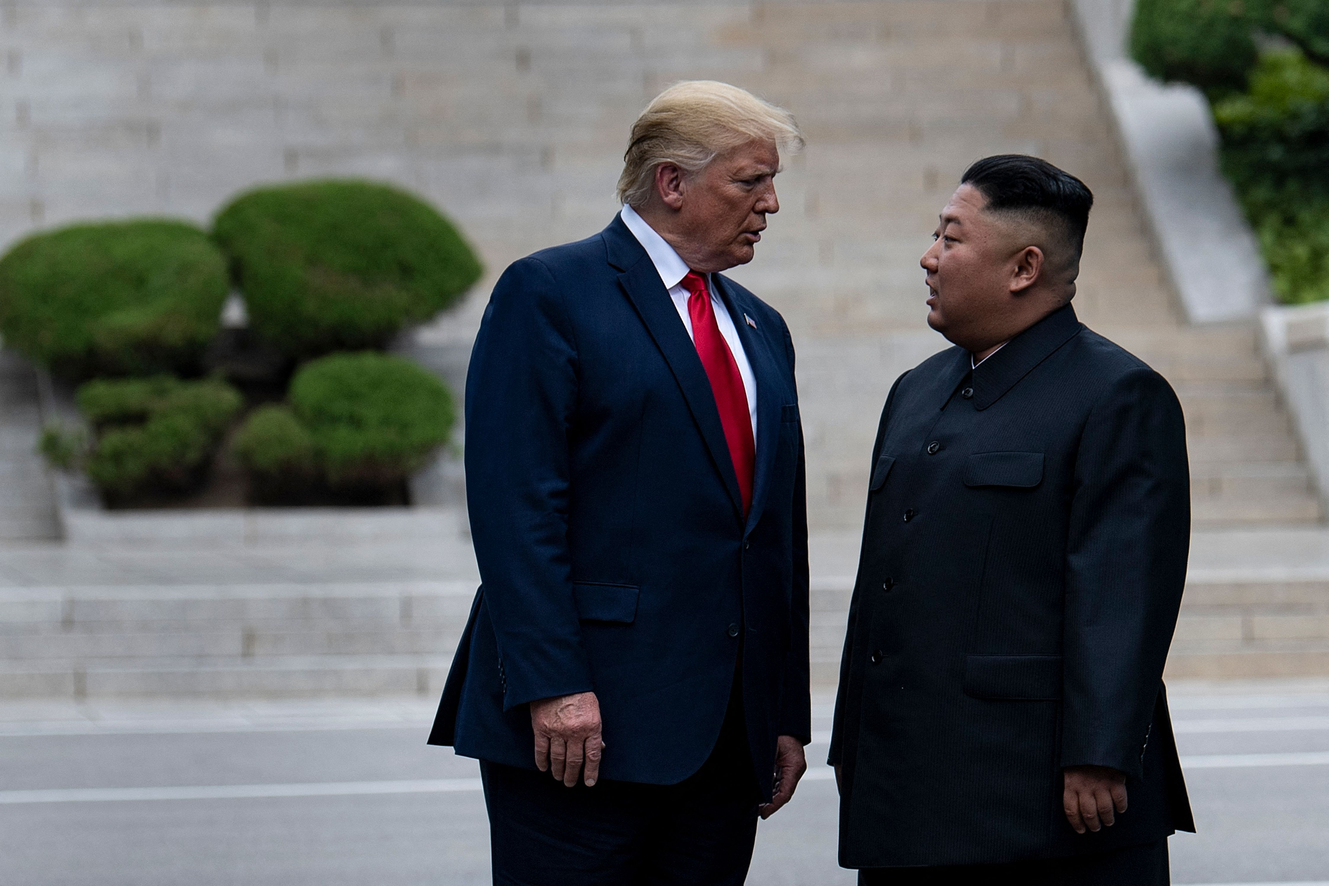 US President Donald Trump and North Korea's leader Kim Jong-un stand on North Korean soil while walking to South Korea in the Demilitarized Zone(DMZ) on June 30, 2019, in Panmunjom, Korea. 