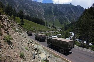 Indian army convoy moves along the Srinagar-Leh National highway towards Ladakh on 17 June 2020. At least 20 Indian soldiers were killed in a violent clash with Chinese forces in a disputed border area.