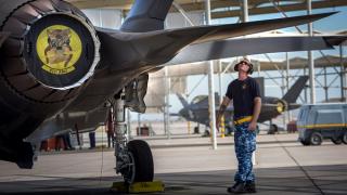 Royal Australian Air Force aircraft maintainer Corporal Cory Cochrane inspects the wing of an Australian F-35A on the flight line at Luke Air Force Base, Arizona