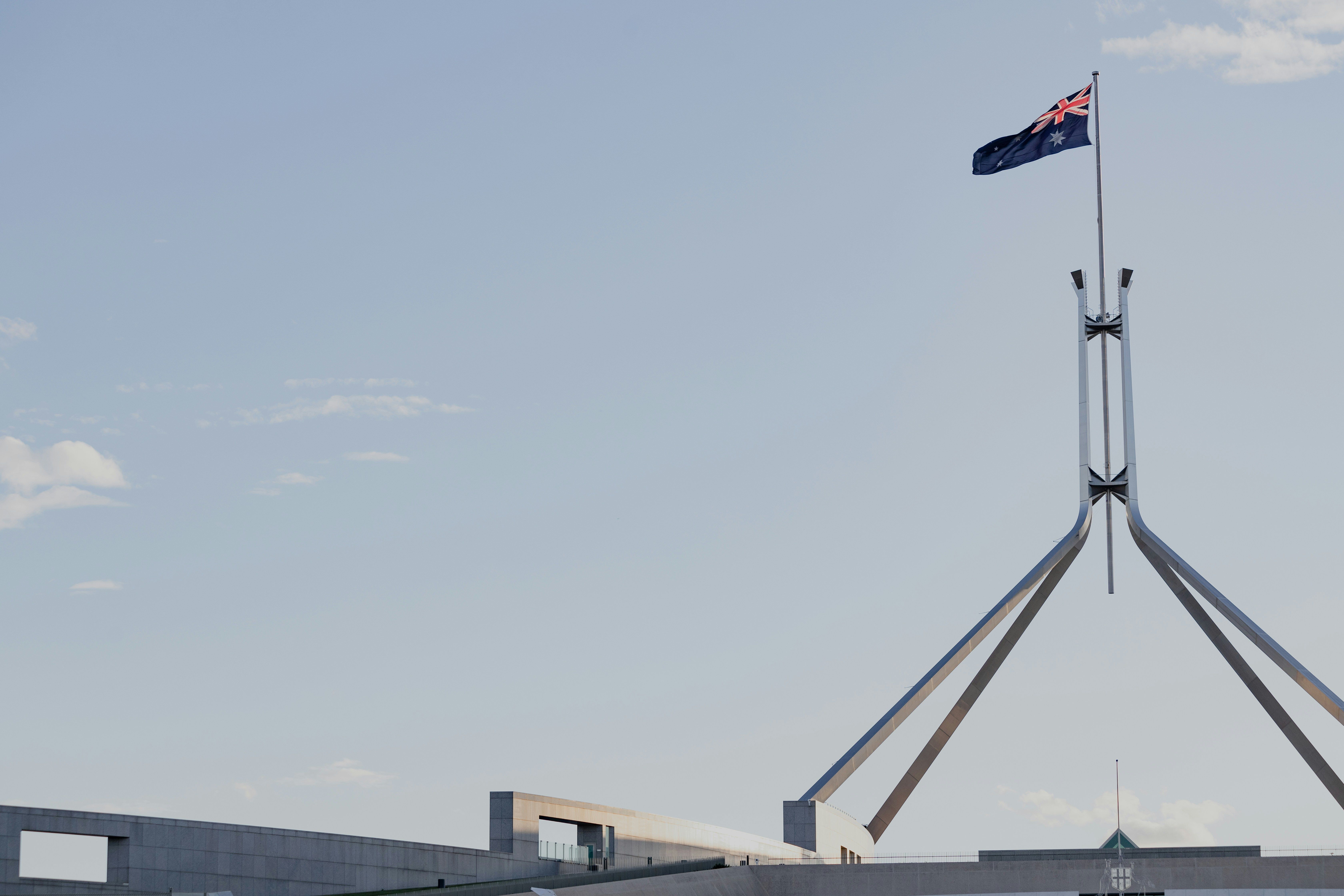 image of Australian flag flying over Parliament House