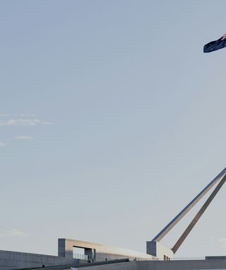 image of Australian flag flying over Parliament House