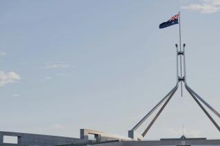 image of Australian flag flying over Parliament House