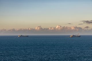 US Logistics Naval Vessel — Fisher and Vehicle Cargo Ship — Bob Hope waiting offshore ready to conduct Joint Logistics Over The Shore (JLOTS) in Bowen during Exercise Talisman Sabre 2023