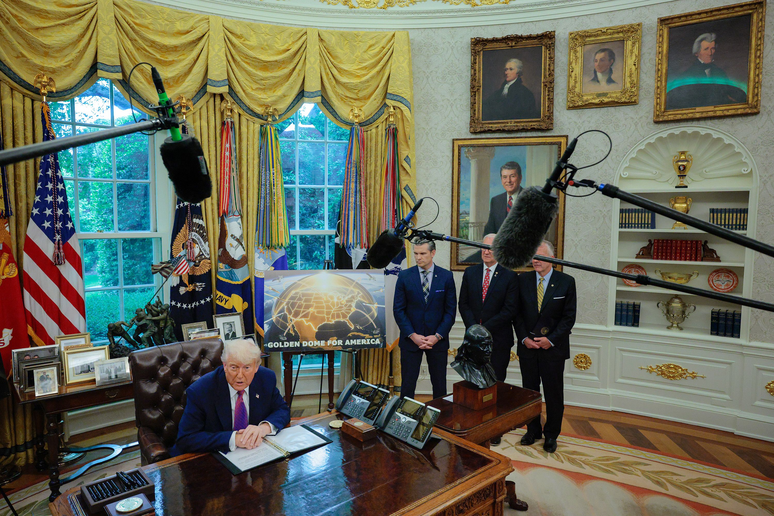 US President Donald Trump talks about the ‘Golden Dome’ missile defence initiative with Defense Secretary Pete Hegseth, Senator Kevin Cramer and Senator Dan Sullivan in the Oval Office, May 2025. 