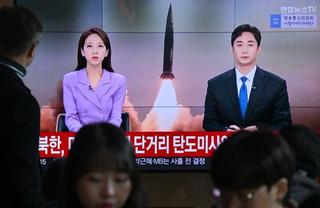 A news broadcast with file footage of a North Korean missile test, at a railway station in Seoul on November 5, 2024