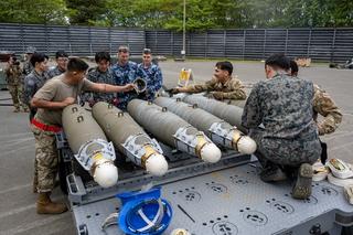 US Air Force, Royal Australian Air Force and Japan Air Self-Defense Force members construct munitions during a Combat Ammunition Production Exercise at Misawa Air Base, Japan, May 2024