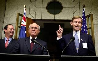 Prime Minister John Howard and US Trade Representative Bob Zoellick announcing the AUSFTA, with Trade Minister Mark Vaile (left), at Parliament House, Canberra, November 2002