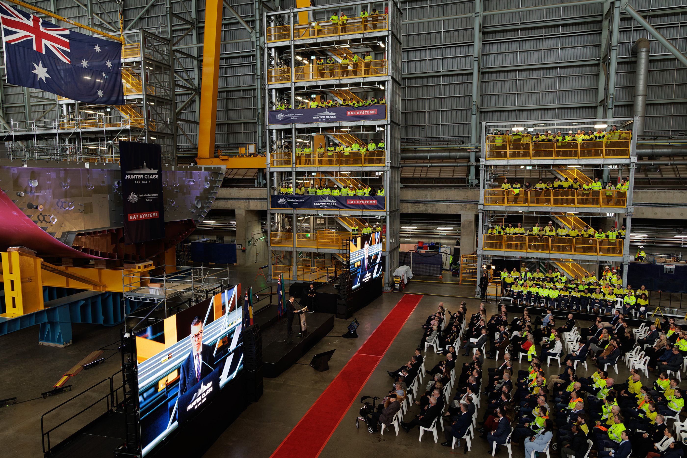 Minister for Defence Industry, the Honourable Pat Conroy MP addresses BAE Systems Australia workers and Defence representatives while attending the Hunter Class Frigate keel laying ceremony at Osborne Naval Shipyard. 