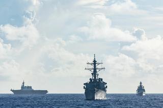 Japan Maritime Self-Defense Force Hyuga-class helicopter destroyer JS Hyuga, US Arleigh Burke-class destroyer USS Fitzgerald and Indian Navy Shivalik-class frigate INS Sahyadri conduct a surface warfare exercise off the coast of Guam during Exercise MALABAR 25.