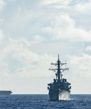 Japan Maritime Self-Defense Force Hyuga-class helicopter destroyer JS Hyuga, US Arleigh Burke-class destroyer USS Fitzgerald and Indian Navy Shivalik-class frigate INS Sahyadri conduct a surface warfare exercise off the coast of Guam during Exercise MALABAR 25.