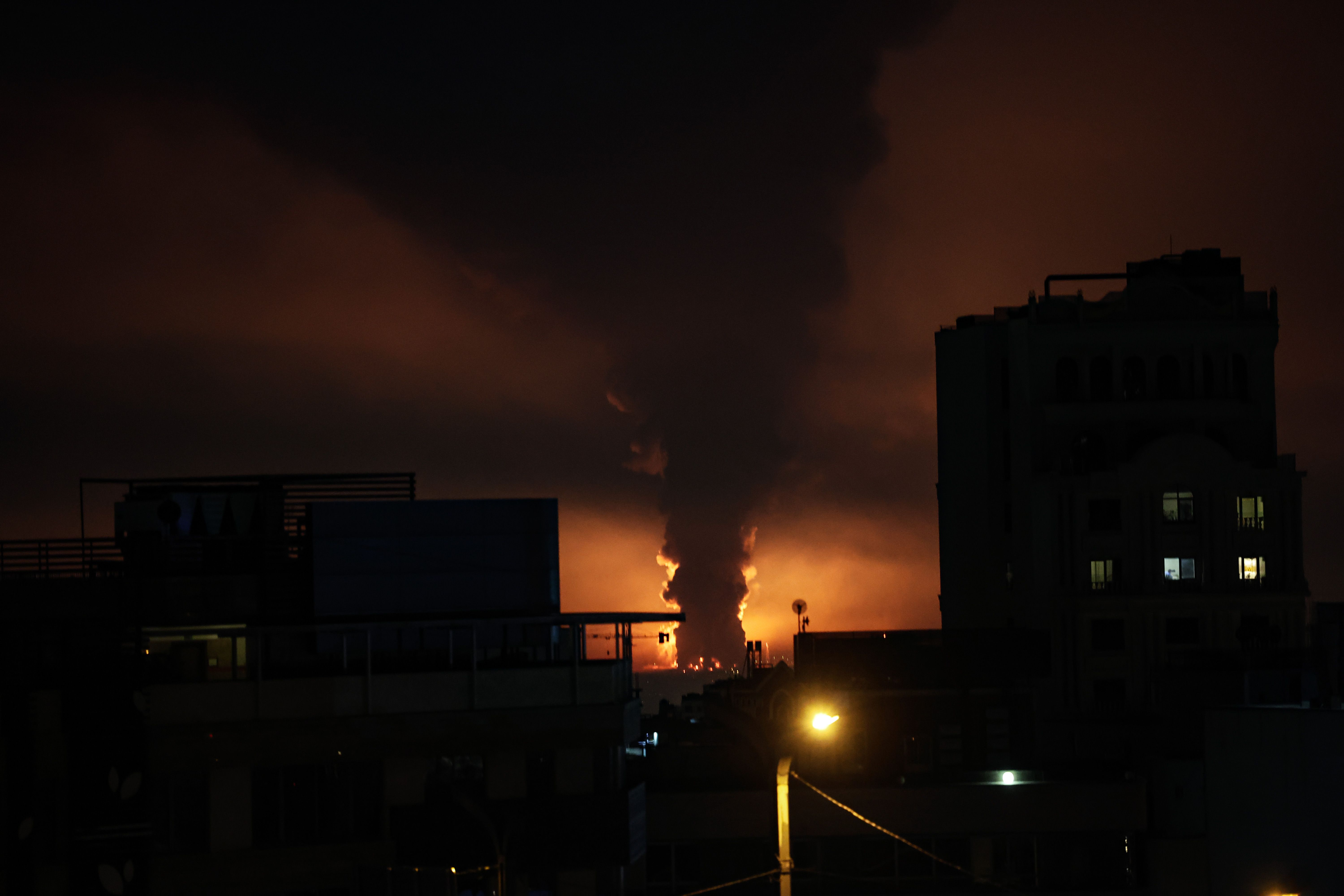 A large plume of smoke rises over Tehran after explosions were reported in the city during the night on March 07, 2026 in Tehran, Iran. 