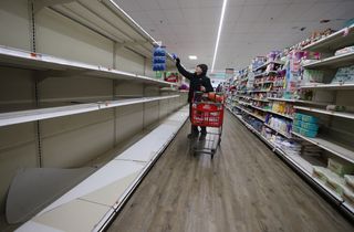 Vulnerable groups in Australia and the United States are having difficulty purchasing essential items as stores struggle to restock shelves (Getty).