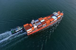 A cargo ship carrying foreign trade containers enters the port in Qingdao City, Shandong Province, China, on April 20, 2025.