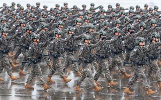 South Korean troops march during a ceremony marking the 75th founding anniversary of the country’s armed forces day at Seoul Air Base