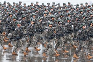 South Korean troops march during a ceremony marking the 75th founding anniversary of the country’s armed forces day at Seoul Air Base