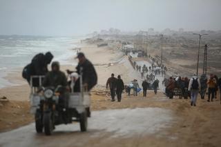 Palestinians return to their neighborhoods despite the ongoing challenges and devastation caused by recent conflict.