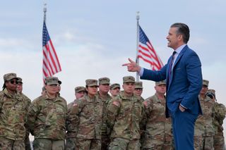 US Secretary of War Pete Hegseth address a group of National Guard troops before administering their re-enlistment ceremony at the base of the Washington Monument on 6 February 2026
