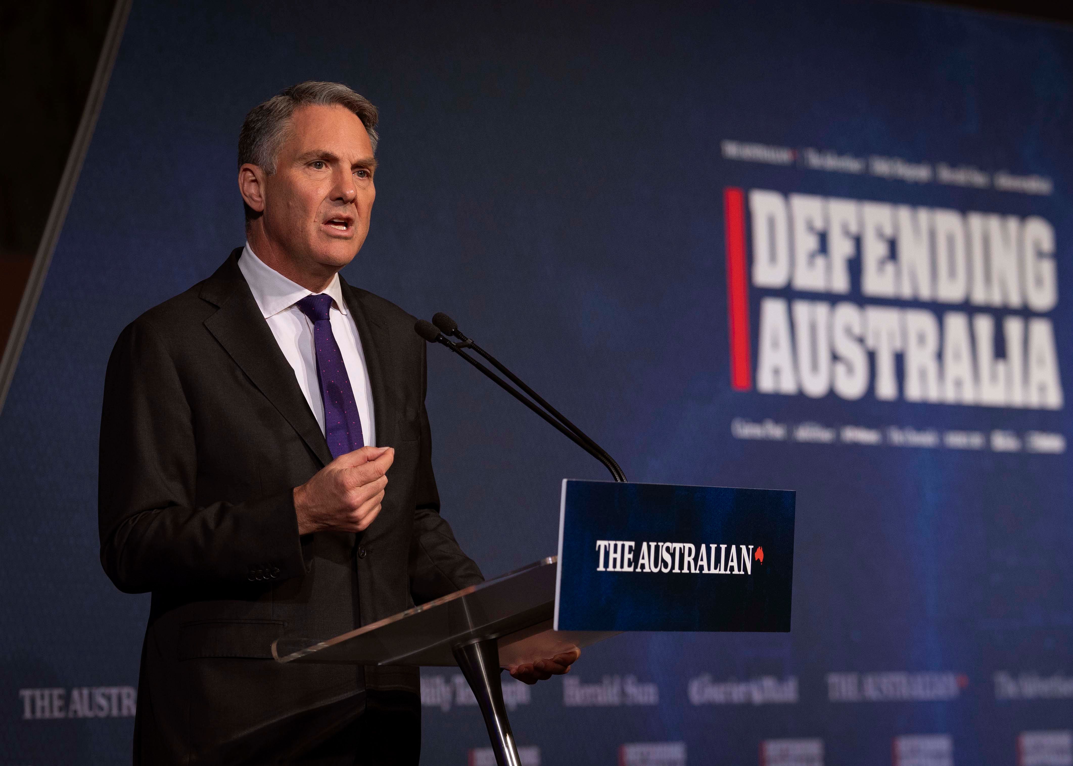 Person speaking at a lectern