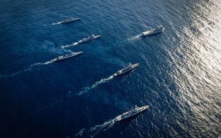 A US P8 Poseidon crew participate in an Anti Submarine Warfare mission off Darwin during Exercise Kakadu 2016