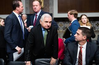 People mulling in a government building: Senate Armed Services Chairman Jack Reed and Senator Tom Cotton attend House and Senate committee markup of the National Defense Authorization Act for FY2024.