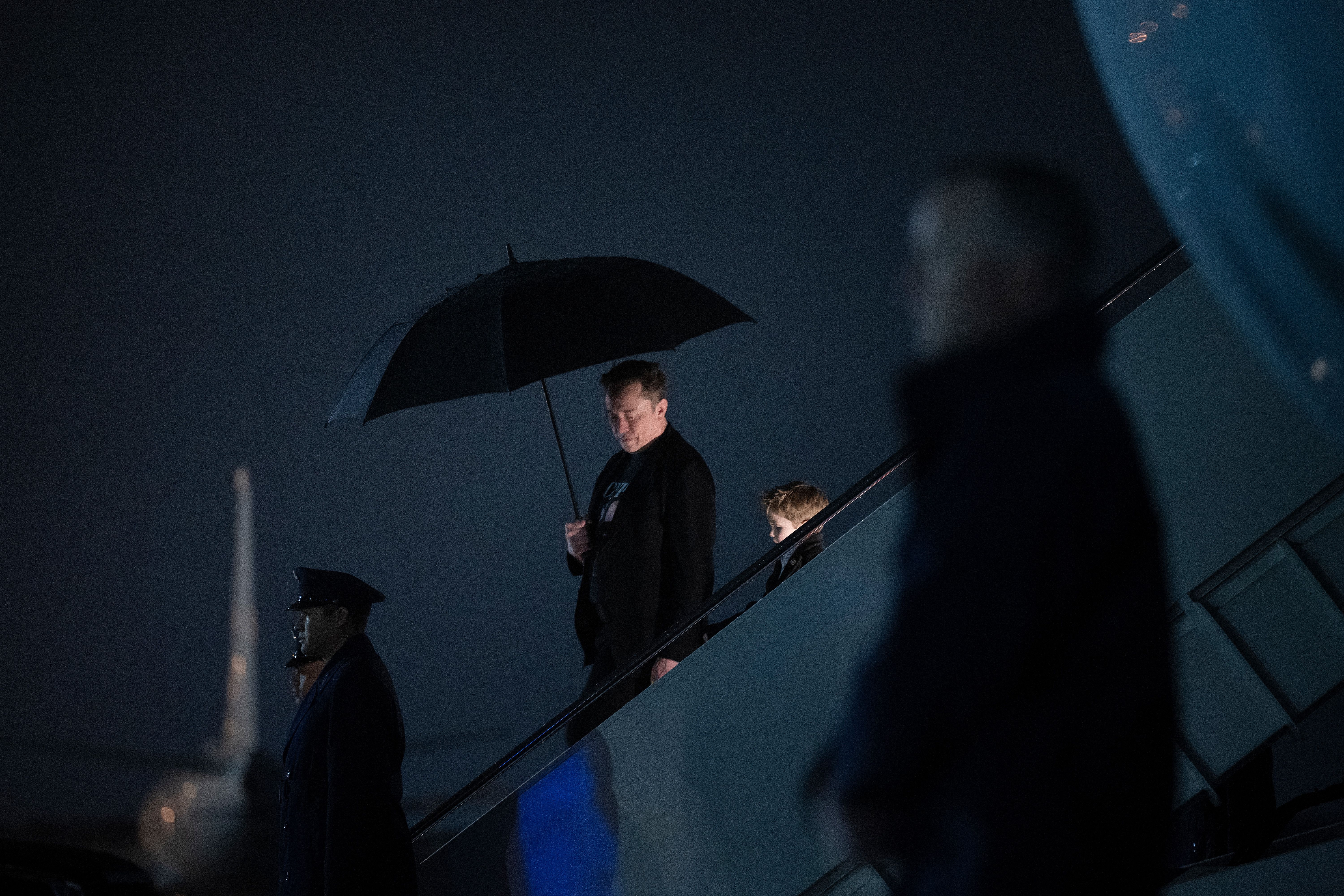 Elon Musk and his son X Æ A-12 step off of Air Force One upon arrival at Joint Base Andrews in Maryland, on March 17, 2025