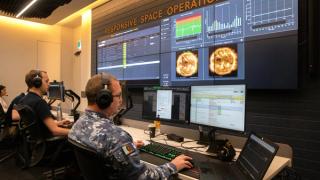 Australian Defence Force and Department of Defence personnel from the Defence Space Command and the Defence Science and Technology Group work alongside an industry team led by SABER Astronautics in the Responsive Space Operations Centre at LOT 14 in Adelaide