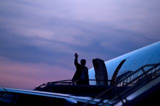 US President Donald Trump waving outside Air Force One