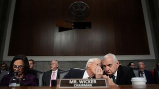 Senate Armed Services Committee Chairman Sen. Roger Wicker (R-MS) (C) talks with Ranking Member Jack Reed (D-RI) during the confirmation hearing for U.S. President-elect Donald Trump's nominee for Secretary of Defense Pete Hegseth