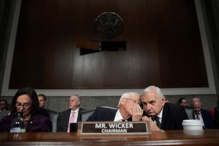 Senate Armed Services Committee Chairman Sen. Roger Wicker (R-MS) (C) talks with Ranking Member Jack Reed (D-RI) during the confirmation hearing for U.S. President-elect Donald Trump's nominee for Secretary of Defense Pete Hegseth