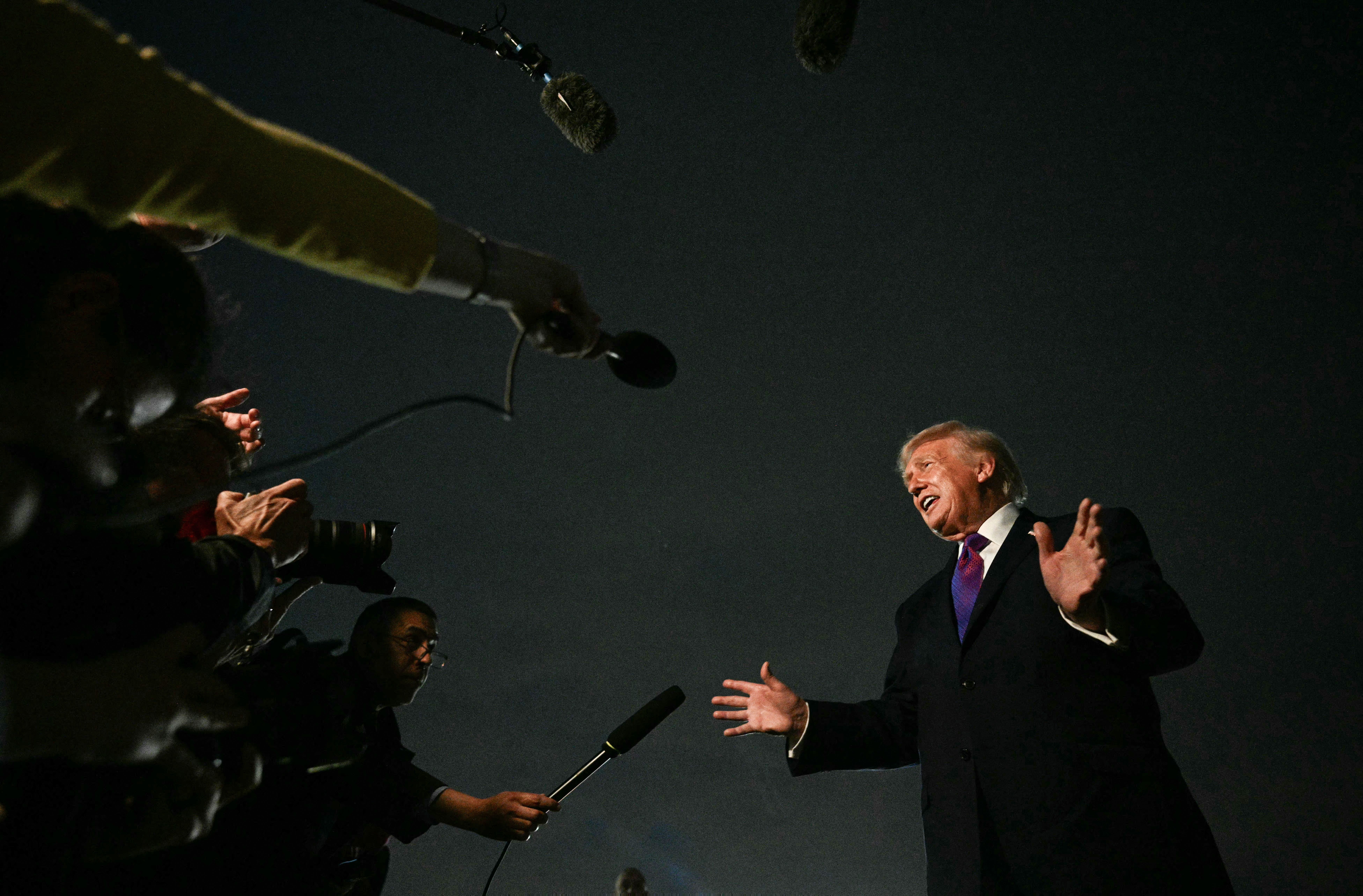 US President Donald Trump speaks to journalists upon returning to Joint Base Andrews, Maryland on 11 March 2026.