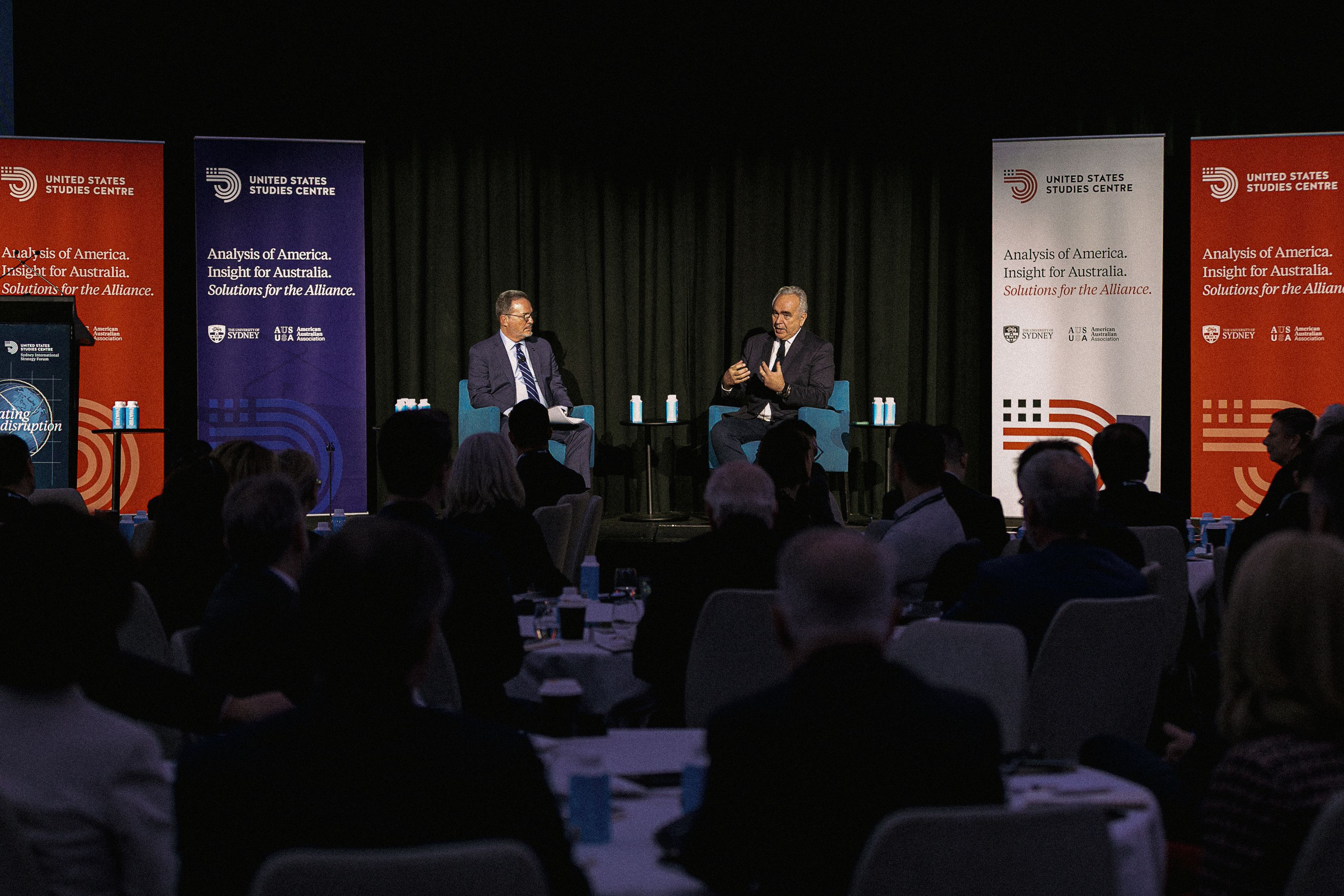 Dr Kurt Campbell talking on stage with Dr Michael Green