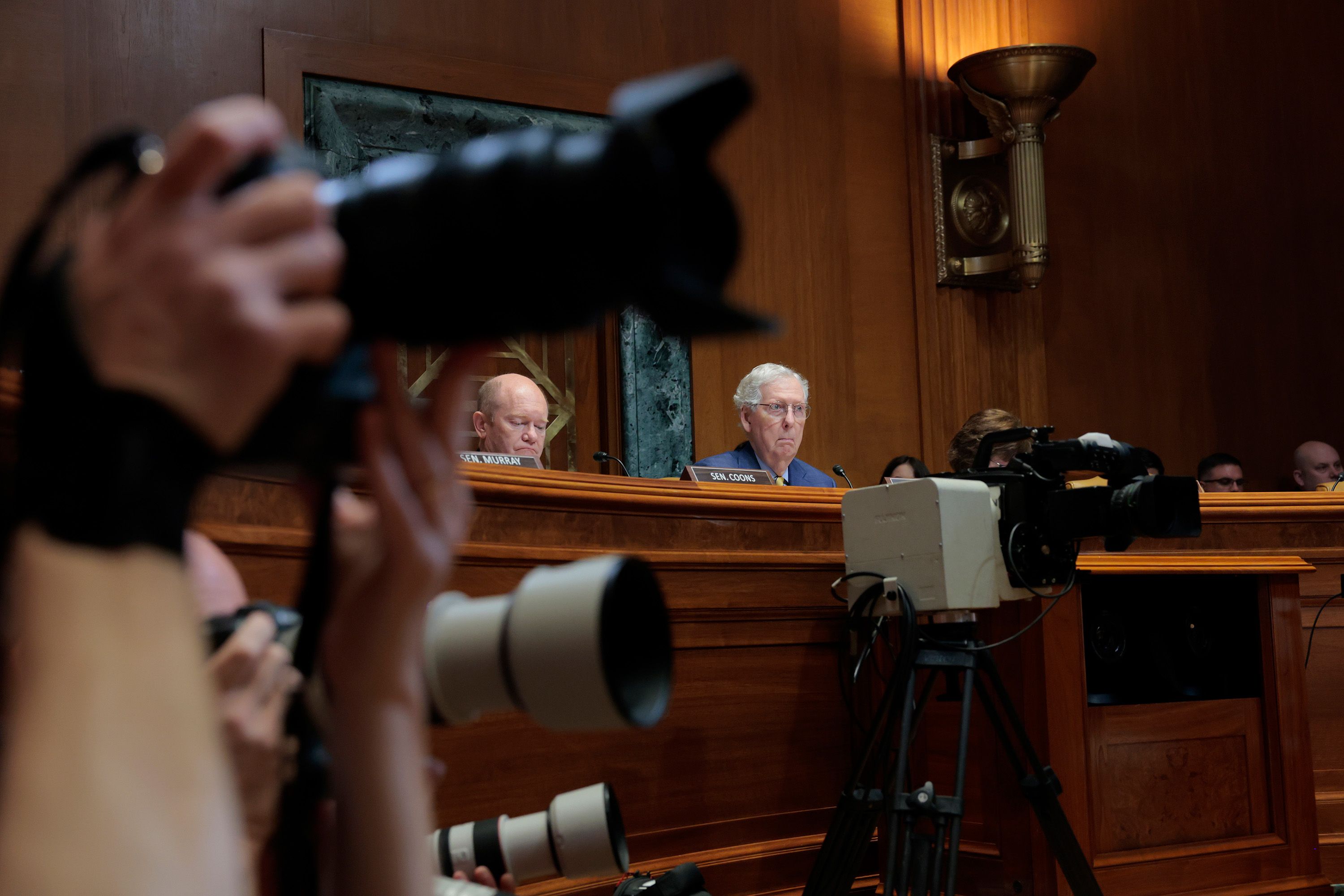 Ranking member Senator Chris Coons and Subcommittee Chairman Senator Mitch McConnell listen during a hearing before the Senate Appropriations Committee in June 2025. The Senate Appropriations Subcommittee on Defense met with Department of Defense officials to discuss US President Donald Trump’s fiscal year 2026 budget request.