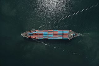 Shipping container entering port