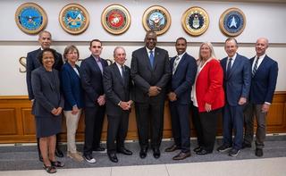 Secretary of Defense Lloyd Austin stands with members of the US Defense Innovation Board at the Pentagon, July 2023.