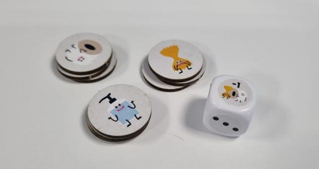 Jetons illustrés et dé personnalisé du jeu Confin'it