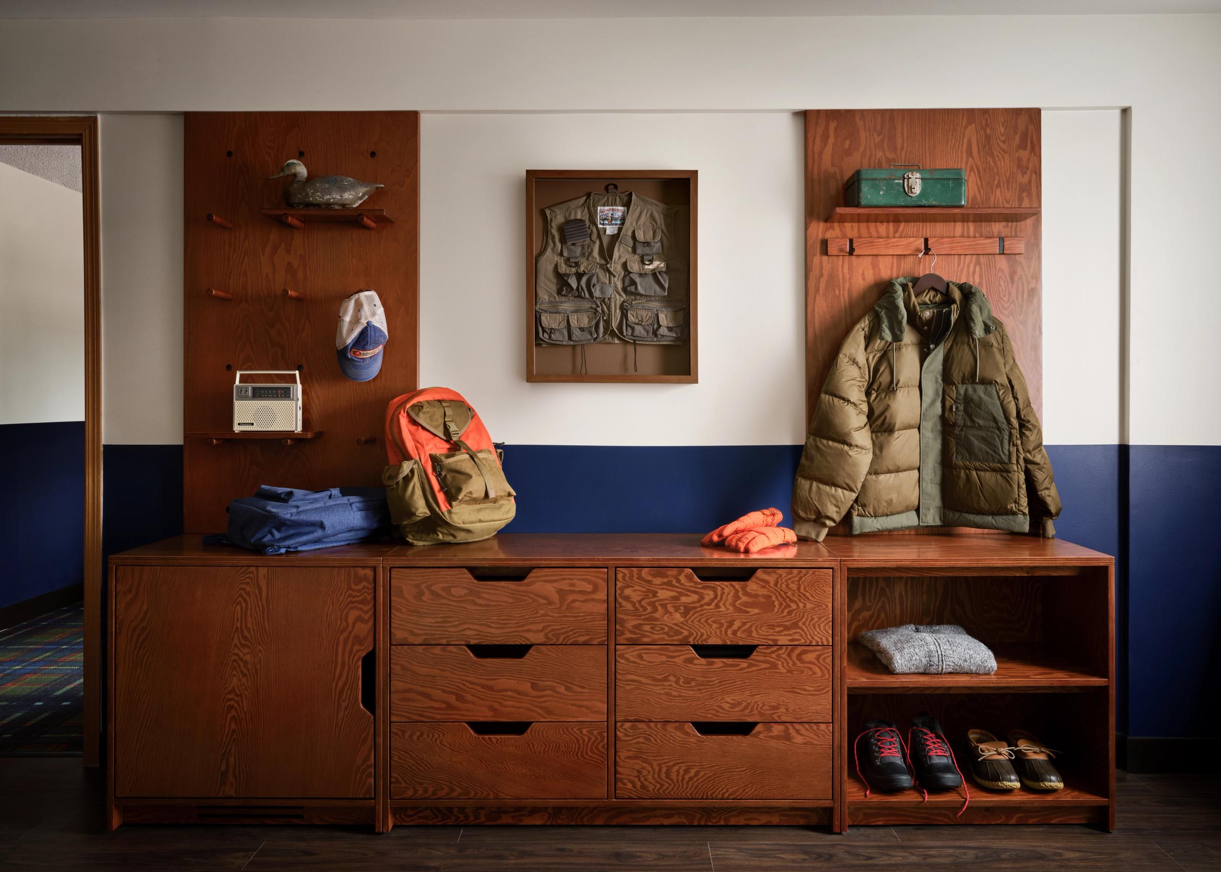 peg board and dresser in guest room