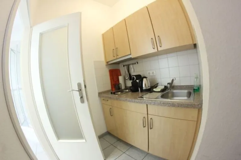 Kitchen area in Apartment Room 1 – Hotel Almrausch Bad Reichenhall