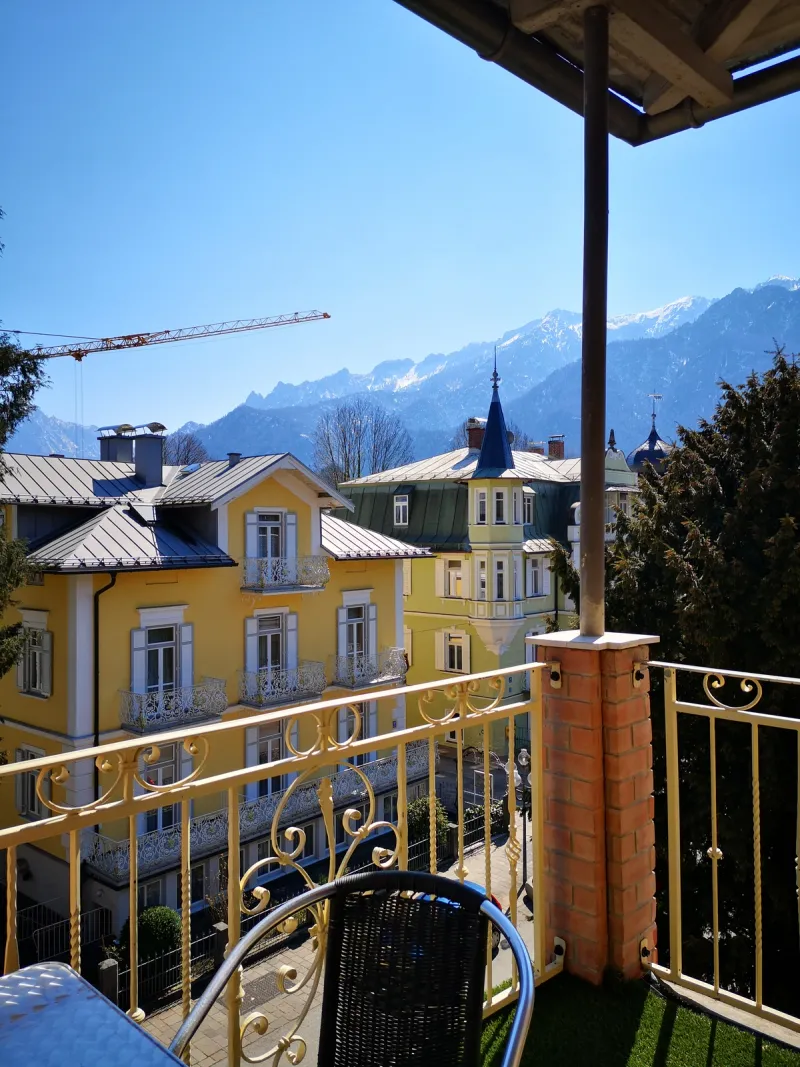Balcony view Hotel Almrausch Bad Reichenhall – view of historic Art Nouveau houses and Alps
