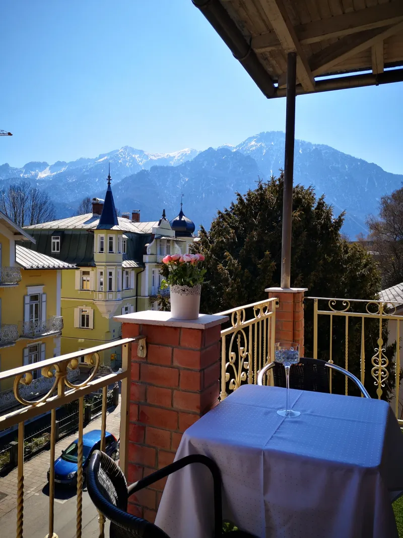 Panoramic view from Hotel Almrausch balcony over Bad Reichenhall and the surrounding Alps